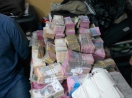 В Киеве у фигурантов уголовного дела изъяли более 330 тыс. долларов и 200 тыс. гривен