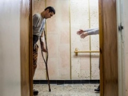 Раны: в Киеве открылась фотовыставка, посвященная искалеченным бойцам АТО (фото)