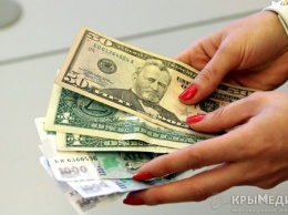 Доллар на Московской бирже подорожал почти на рубль