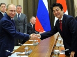 Премьер-министр Японии хочет пригласить в страну Путина с неофициальным визитом