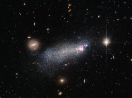 Галактику с тяжелыми умирающими звездами сфотографировал Hubble