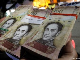 Нехватка наличных денег в Венесуэле вызвала беспорядки