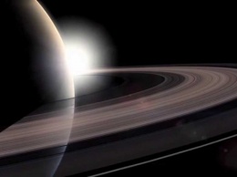 Зонд Cassini сделал прощальную фотографию Земли сквозь кольца Сатурна