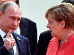Меркель готовилась к встрече с Порошенко, созваниваясь с Путиным