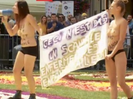 Femen устроили акцию протеста на цветочном ковре в Брюсселе