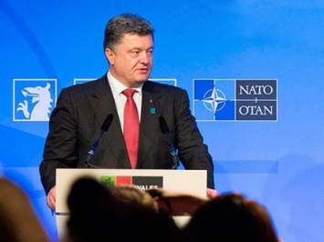 В НАТО ожидают услышать от П.Порошенко в Варшаве отчет о выполнении минских соглашений