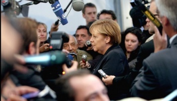 Меркель пообещала Греции и Италии облегчить их миграционное бремя