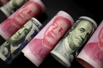 Китай существенно поднял курс юаня к доллару