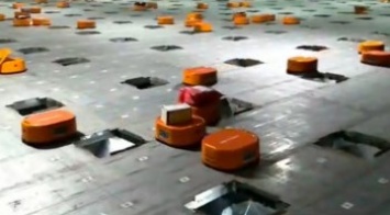Маленькие оранжевые роботы в Китае сортируют 200 000 посылок в день (видео)