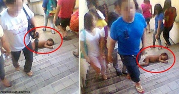 Шокирующие фото: голый младенец лежит на ступенях - и всем все равно!