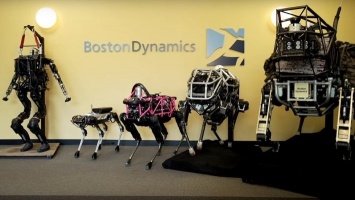 Ученые научили робота-собаку открывать двери другому роботу (ВИДЕО)