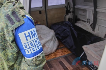 ФОТОФАКТ. Боевики "ЛНР" передали украинской стороне тело погибшего бойца ВСУ