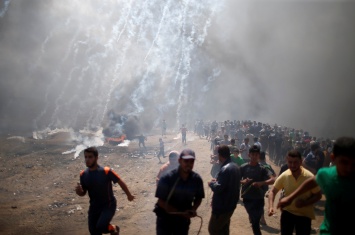 В секторе Газа тысячи палестинцев участвовали в похоронах
