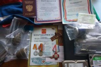 На Херсонщине в доме пособника оккупантов нашли медали за аннексию Крыма, российские документы и гранаты