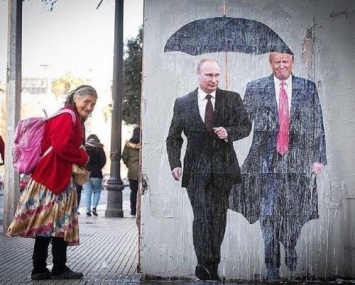 В Польше показали, кто на самом деле носит зонт за Путиным