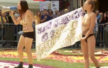 Femen устроили акцию протеста на цветочном ковре в Брюсселе