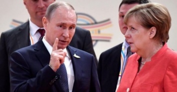 В Кремле заявили о переговорах Путина и Меркель о статусе Донбасса
