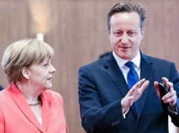 Меркель и Кэмерон договорились не снимать санкции с России