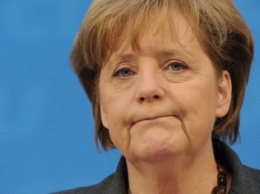 Меркель защитила офис от беженцев