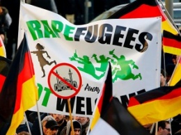 Если бы Германия была Сингапуром, Меркель справилась бы с проблемой беженцев "на раз" (ОБЗОР)