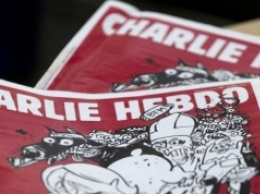 Charlie Hebdо выпустил карикатуры на теракты в Брюсселе