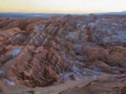 Ученые: На Марсе бывает снег, а на Юпитере - шторм