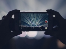 Apple патентует технологию блокировки камер смартфонов на концертах