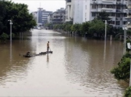 В результате наводнения в Китае погибли десятки человек