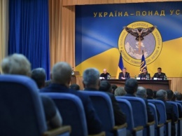 Рогозин назвал "дебильной" новую символику украинской разведки с пронзенной Россией