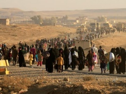 Боевики ИГ взяли в заложники тысячи мирных жителей