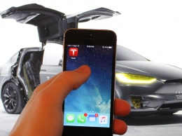 Электромобили Tesla будут узнавать владельца по отпечатку пальца на iPhone