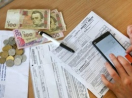 Долги за коммуналку: в Украине хотят автоматически снимать деньги с банковских карт