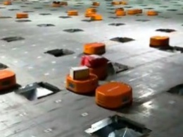 Маленькие оранжевые роботы в Китае сортируют 200 000 посылок в день (видео)