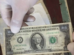 В Запорожской области заключенный превращал один доллар в сто