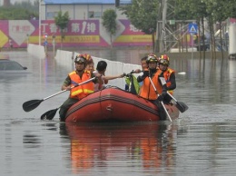 В Китае в мощном наводнении пострадали больше 11 тысяч человек