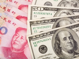 Китай укрепил юань к доллару до максимума за 2,5 года