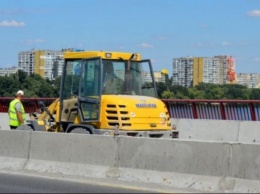 300 миллионов на ремонт моста в Днепре разыграют не чужие друг другу фирмы
