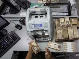 К концу года инфляция в Венесуэле достигнет 1000000% - МВФ