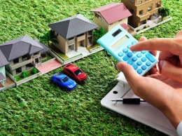 Как украинцы в этом году будут платить налоги на недвижимость и авто