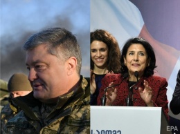 В Украине ввели военное положение, в Грузии прошли выборы президента. Главное за день