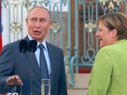 На ужине в Аргентине Путин накормил Меркель икрой
