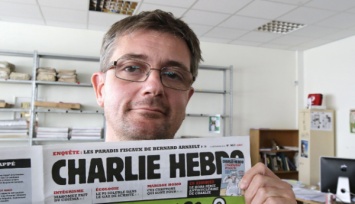 Charlie Hebdo опубликовал карикатуру на воображаемый теракт на матче Россия-Англия