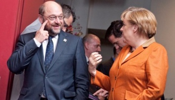 Германия: партия Шульца теряет голоса, партия Меркель набирает